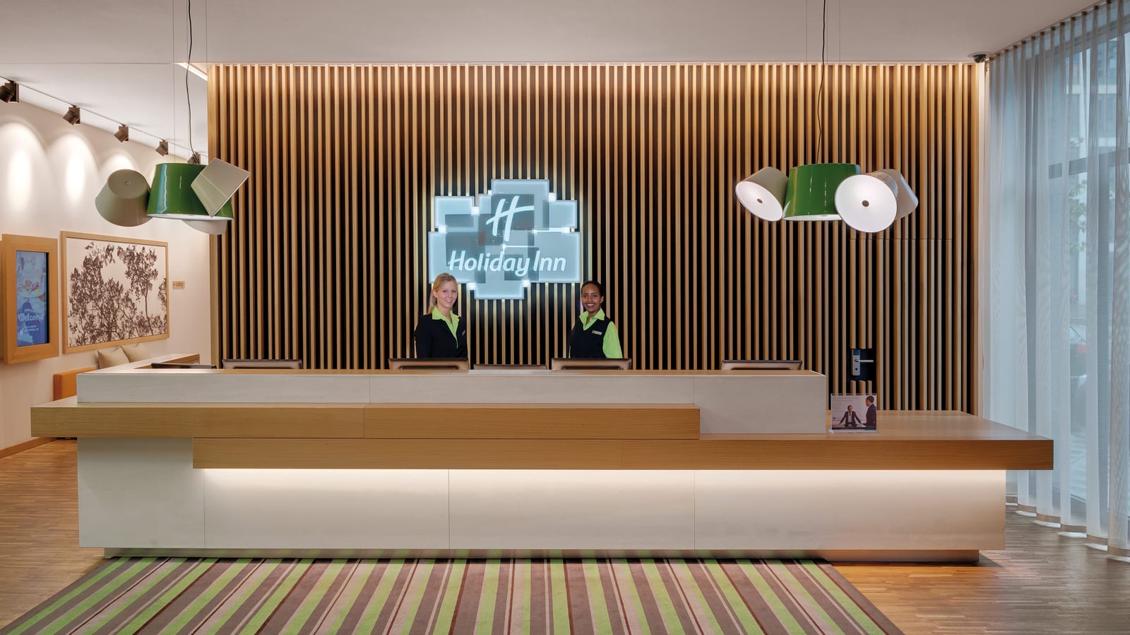 The Open Lobby at Holiday Inn Frankfurt - Alte Oper combines reception, the Francis Sports Bar, and a 24-hour self-service store in one space.